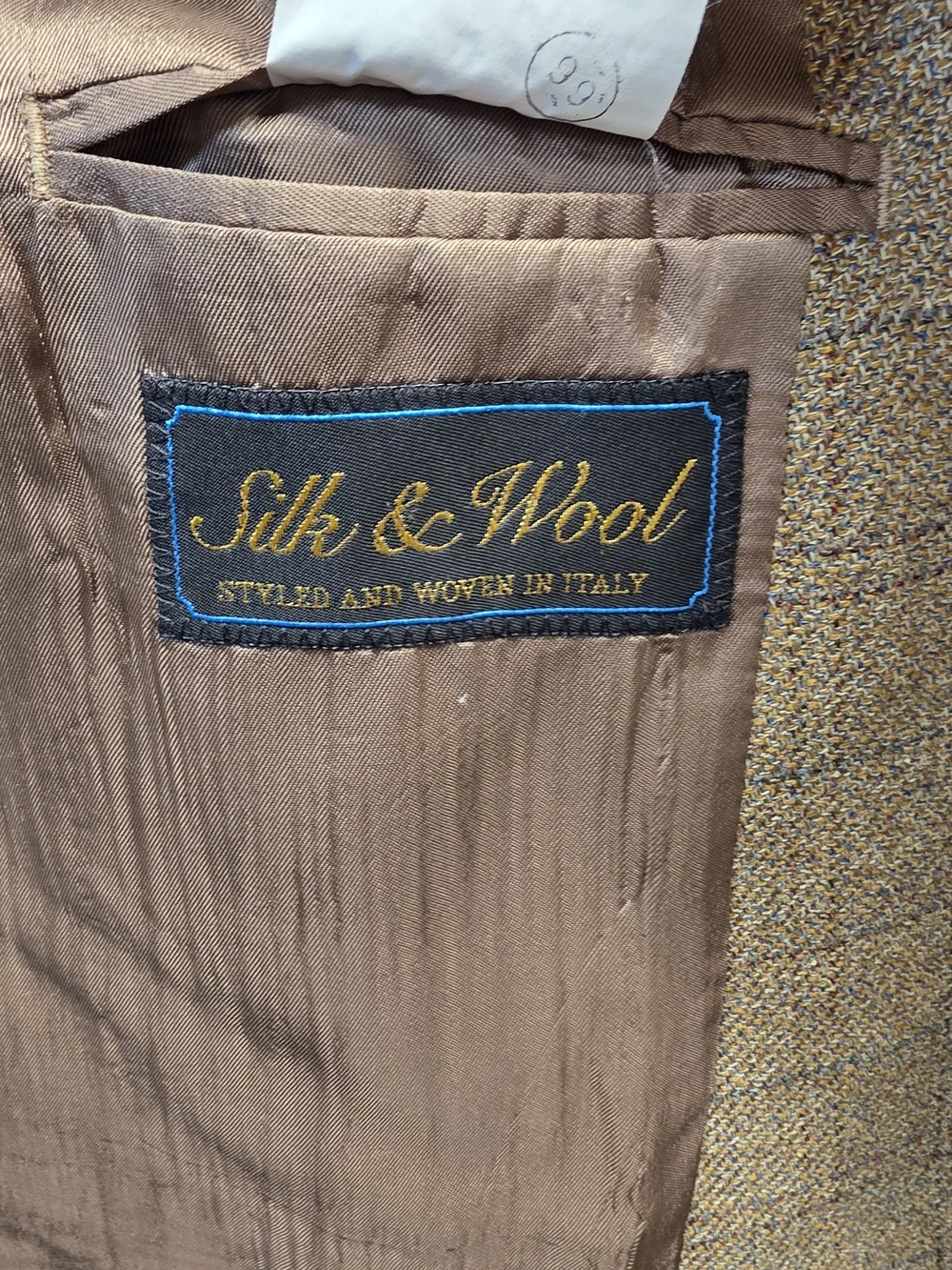 52%silk 48%wool classic brown sport coat featuring a windowpane plaid pattern